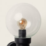 Applique murale noire à globe en verre transparent avec ampoule filament visible