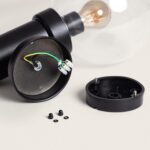 Applique murale noire cylindrique, fixation murale avec bornier de raccordement et ampoule visible