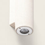 Applique murale cylindrique en ciment beige, éclairage orienté vers le bas