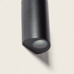 Applique murale cylindrique noire en métal mat, éclairage directionnel vers le bas