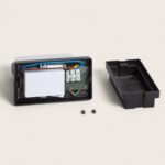 Boîtier électrique ouvert en plastique noir avec transformateur, bornier et deux vis de fixation