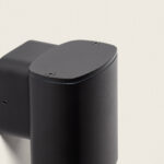 Applique murale extérieure noire en métal mat, corps cylindrique ovale à fixation murale