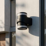 Applique murale extérieure cylindrique noire en aluminium mat, double émission lumineuse, fixation en saillie