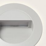 Balise encastrée murale blanche, cadre circulaire et ouverture rectangulaire rainurée