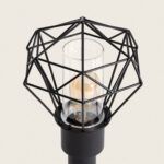 Balise sur pied noire en métal avec cage géométrique et diffuseur cylindrique en verre