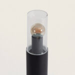 Balise sur pied noire en aluminium avec cylindre en verre transparent et ampoule à filament