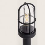 Balise sur pied noire en métal avec dôme en verre et ampoule filament visible