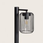 Balise sur pied noire en métal, abat-jour grillagé cylindrique avec ampoule filament visible