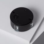 Balise murale LED noire circulaire avec lentilles latérales transparentes, fixation en saillie