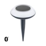 Balise solaire ronde avec panneau solaire, diffuseur blanc, piquet noir et icône Bluetooth visible