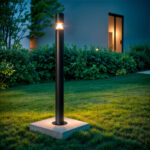 Balise sur pied extérieure noire en aluminium cylindrique 90 cm sur socle béton, éclairage LED