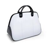 Sac de transport blanc et noir aspect cuir, poignées arrondies