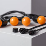 Guirlande guinguette noire étanche avec ampoules sphériques orange et connecteurs étanches