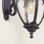 Applique murale extérieure en métal finition bronze, verre martelé ovale et support mural ornemental