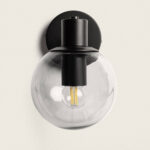 Applique murale en métal noir mat avec globe en verre transparent et ampoule apparent