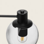 Applique murale extérieure métal noir avec globe en verre clair et ampoule visible