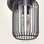 Applique murale extérieure cage métal noir, tube en verre cylindrique et ampoule décorative visible