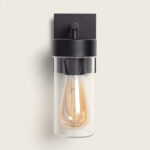 Applique murale extérieure noire en métal avec abat-jour cylindrique en verre transparent et ampoule filament