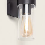 Applique murale noire en aluminium avec abat-jour cylindrique en verre transparent et ampoule apparente