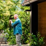 Applique murale extérieure noire en métal et verre, style lanterne, fixée sous l'avant-toit
