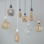 Lampe suspendue extérieure en verre ambre et transparent, formes variées, câbles noirs et blancs