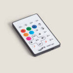 Télécommande rectangulaire blanche pour lampe LED RGBW avec boutons colorés et commandes musique