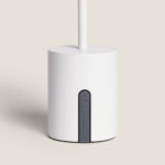 Lampe à poser blanche, socle cylindrique en plastique avec tige verticale et insert gris sur la base