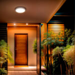 Plafonnier extérieur LED circulaire blanc fixé au plafond au-dessus d'une porte