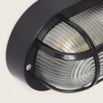 Plafonnier extérieur ovale noir avec grille métallique et verre cannelé