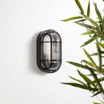 Hublot extérieur ovale noir mural, grille métallique protectrice et globe en verre cannelé