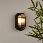 Applique murale extérieure ovale noir à grille métallique et verre cannelé