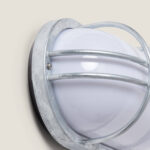 Plafonnier extérieur hublot ovale en acier galvanisé, diffuseur opalin blanc et grille de protection