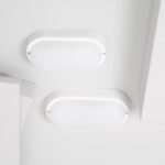 Plafonnier ovale blanc en applique, finition plastique, montage plafond, deux hublots