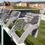 Projecteur LED gris métallique à modules empilés, support courbe, fixation sur structure extérieure de stade