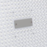 Projecteur LED à matrice de lentilles transparentes avec plaque rectangulaire centrale, boîtier blanc