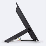 Projecteur LED noir avec boîtier plat, support orientable et câbles apparents