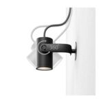 Spot mural noir cylindrique orientable sur support mural avec bras articulé et câble apparent