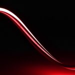Ruban LED néon rouge flexible courbé sur fond noir
