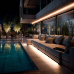 Ruban LED néon blanc chaud installé en ligne extérieure le long d'un canapé près de piscine