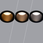 Spot encastrable noir avec baffle intérieur doré, bronze et gris montrant températures de couleur chaud à froid