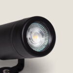 Spot extérieur cylindrique noir avec ampoule GU10 et lentille prismatique