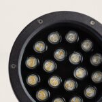 Spot LED rond noir avec plusieurs lentilles visibles, finition métallique