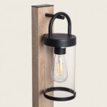 Balise sur pied cylindrique en verre, structure métal noir et fût brun clair avec ampoule filament